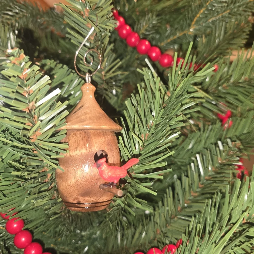 Charming Wooden Birdhouse with Red Bird Accent